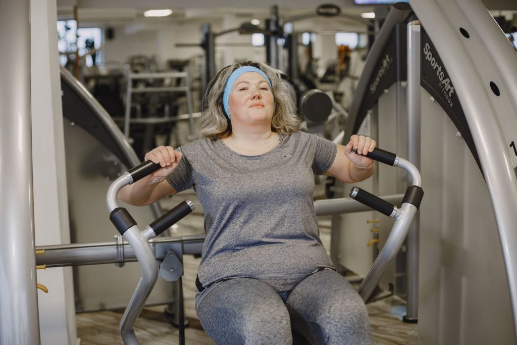 Menopause Strength Gym – middle aged woman lifting weights