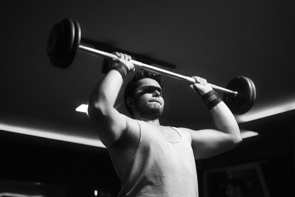Men's Health Gym – man lifting weights gym