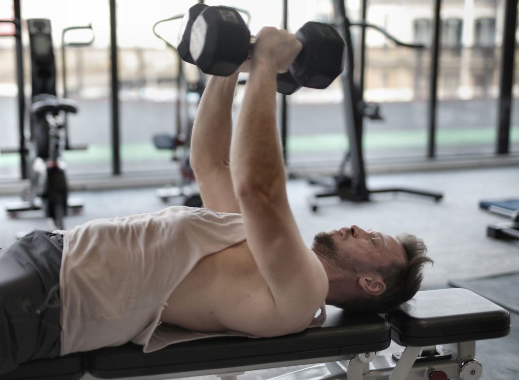 Men's Health Gym – man lifting weights gym