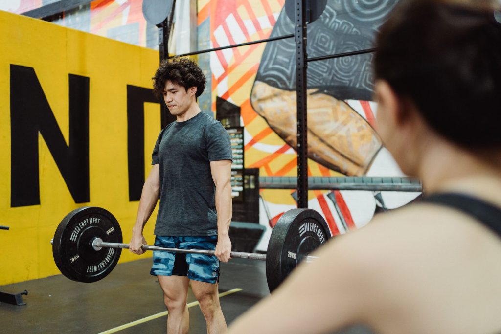 Men's Health Gym – man lifting weights gym