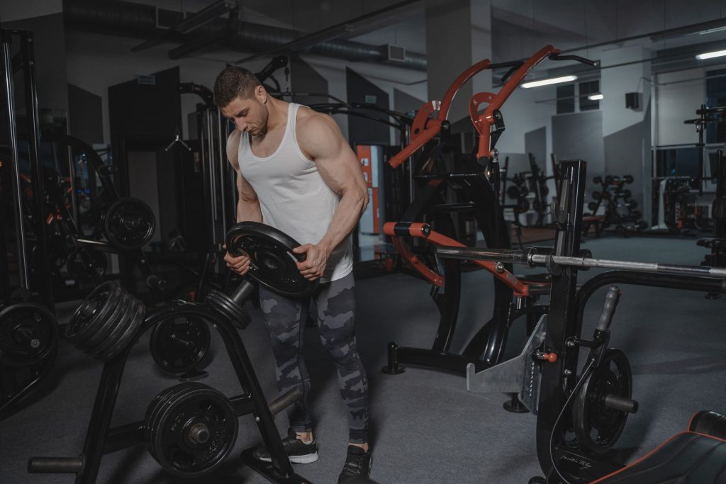 Men's Health Gym – man lifting weights gym