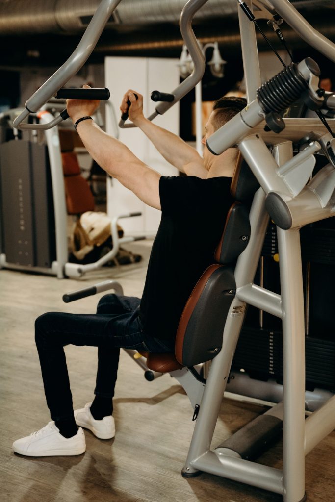 Athlete using professional strength training equipment in a gym