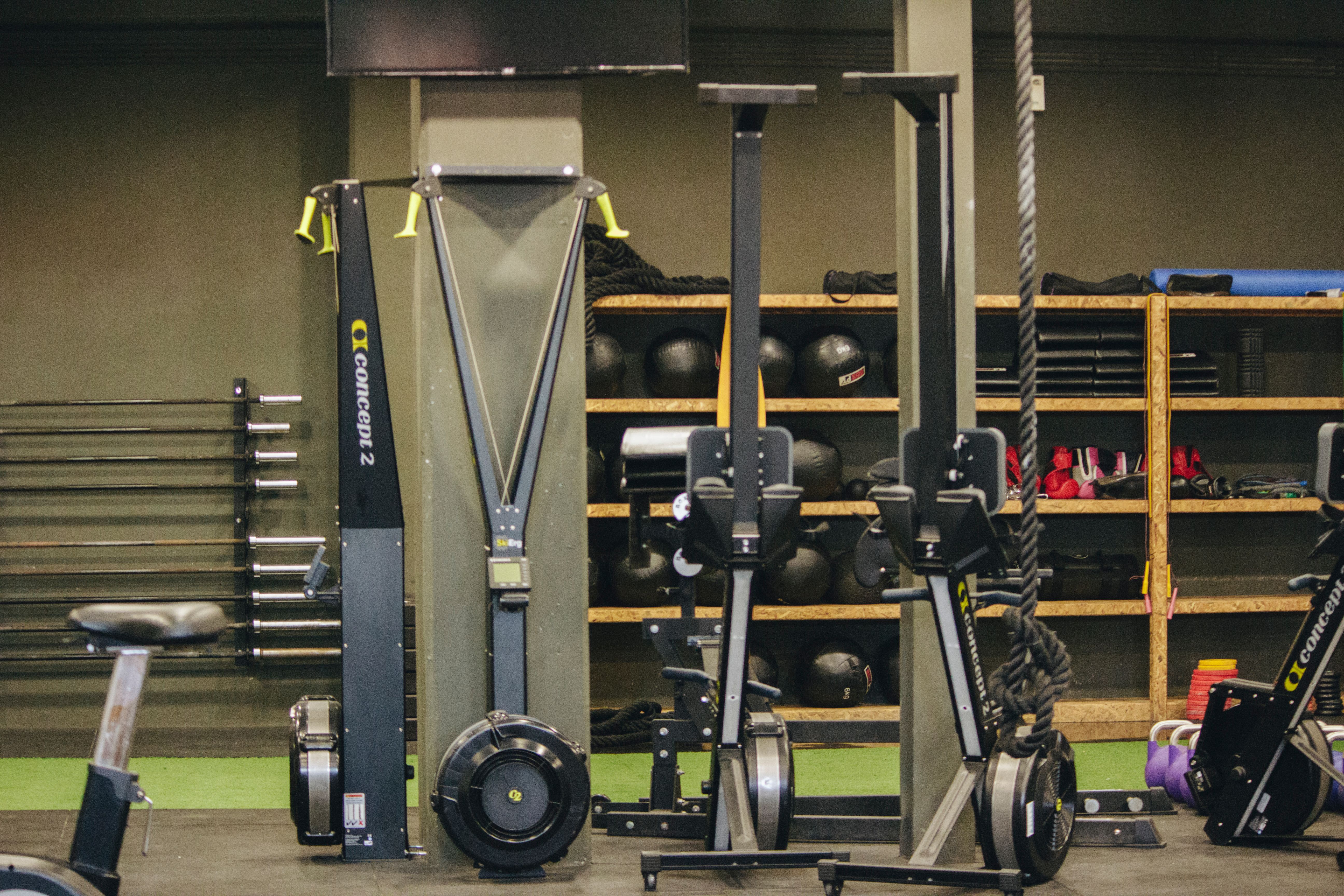 Personal trainer coaching a client in the gym