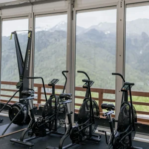 Bright modern gym interior with strength and cardio equipment