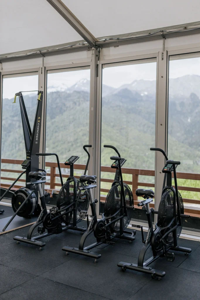 Bright modern gym interior with strength and cardio equipment