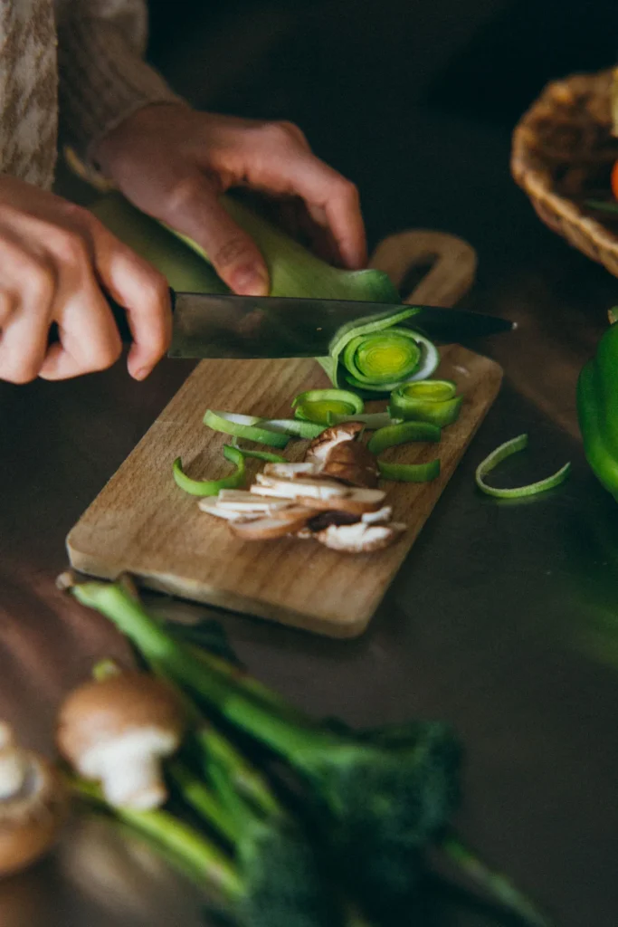 Woman preparing a healthy meal with fresh vegetables
