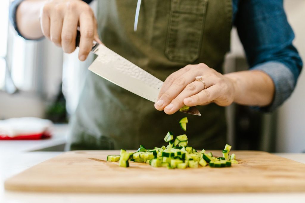 Woman preparing a healthy meal with fresh vegetables