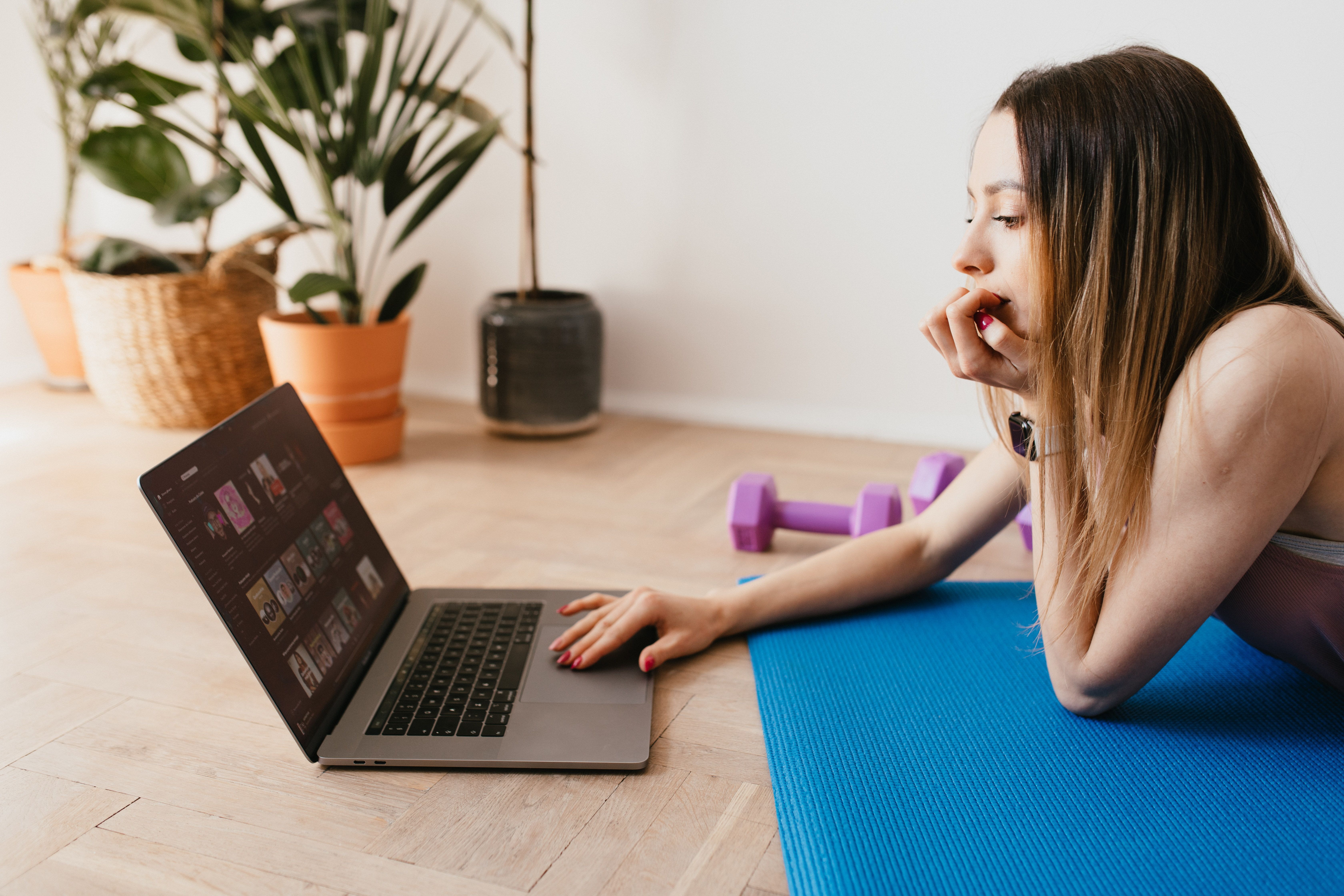 Digital fitness resources and workout planning on a laptop