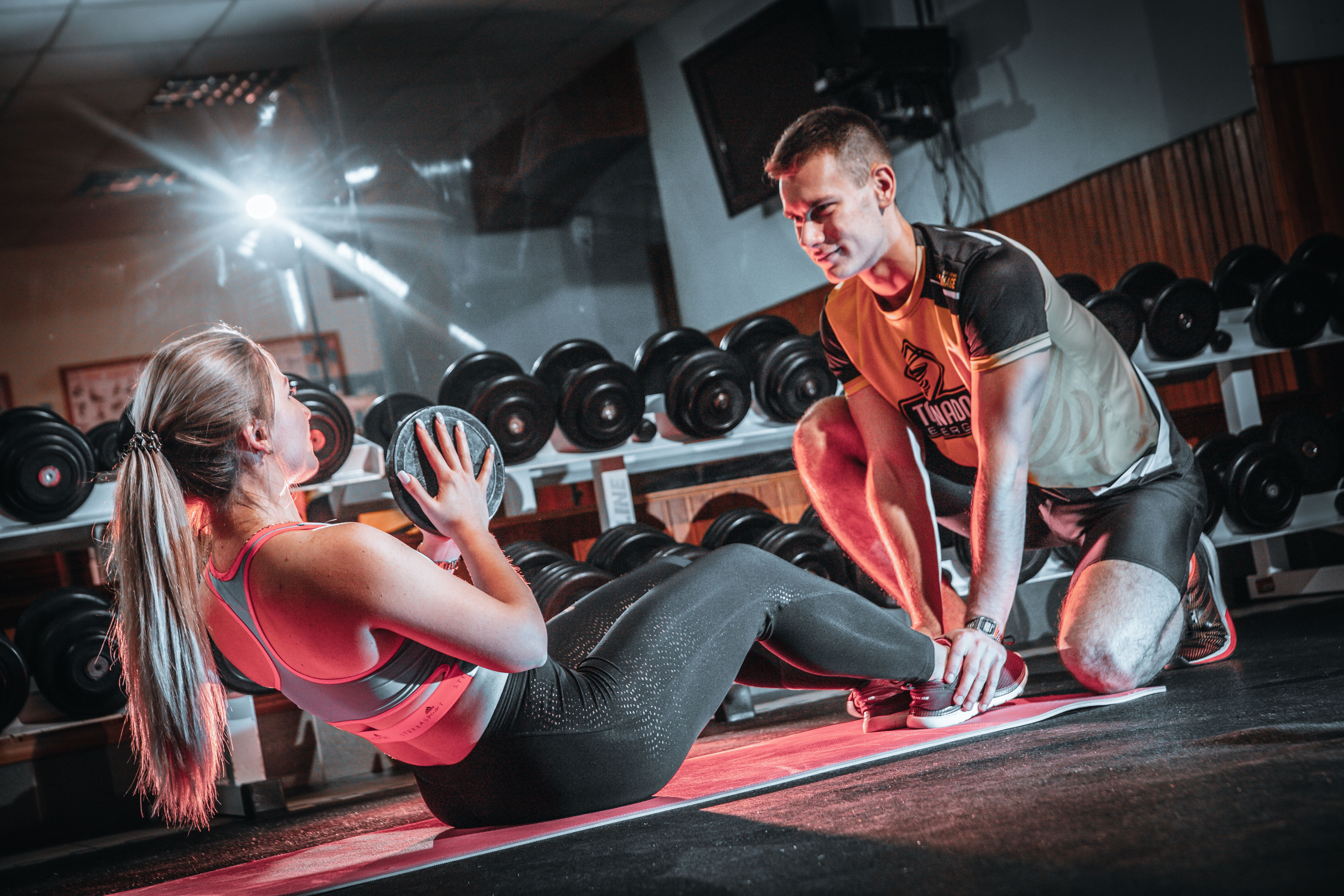 Personal trainer reviewing fitness notes and training ideas