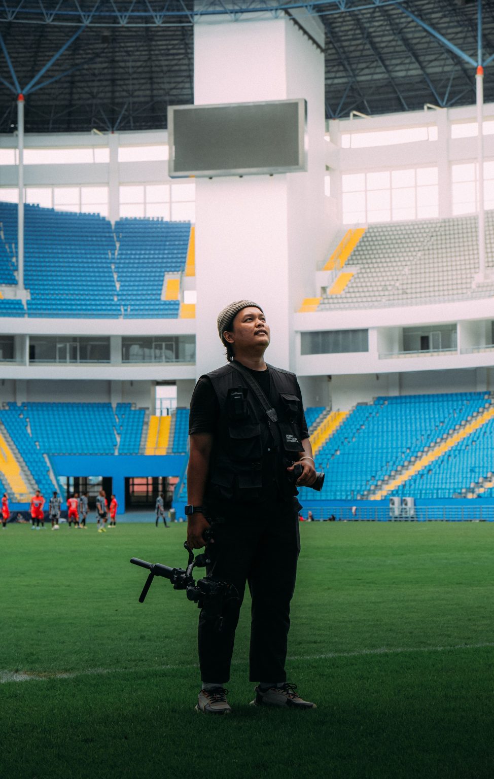 Sports journalist and photographer covering a live event