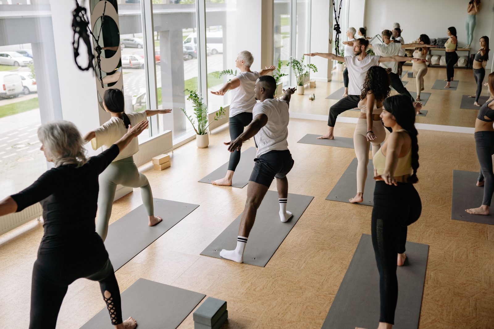 Vinyasa yoga class practicing flow poses