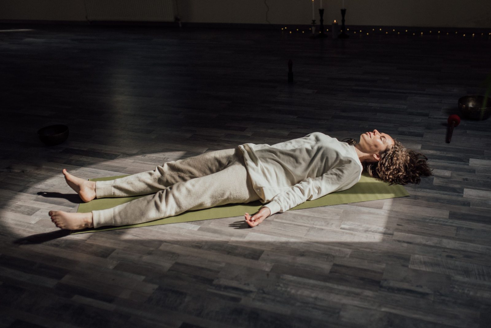 Woman relaxing during a restorative yoga session