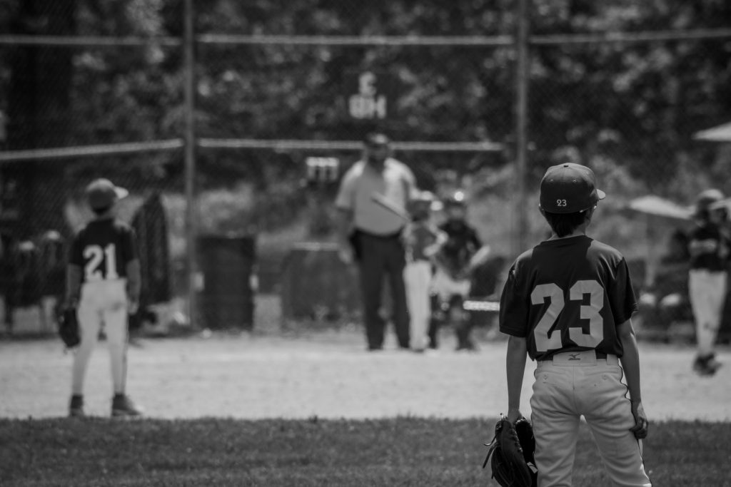 Baseball coach with team