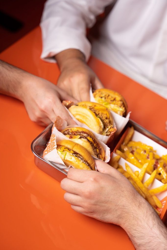 Nexolume Fast Food & Online Delivery burgers and fries in fast food restaurant