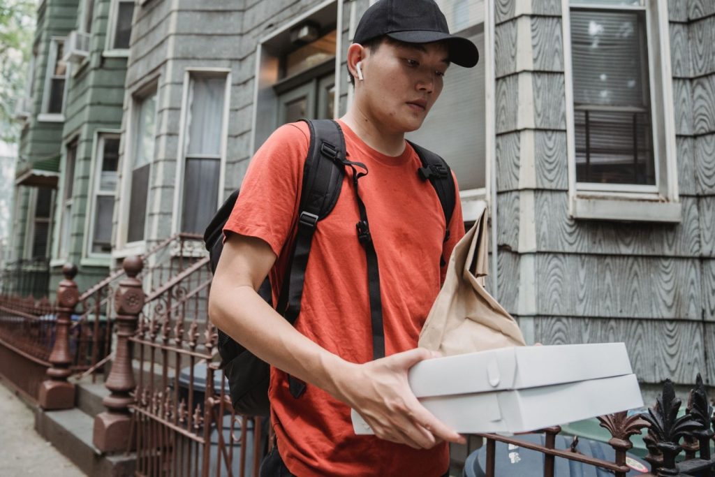 Nexolume Fast Food & Online Delivery courier delivering food order