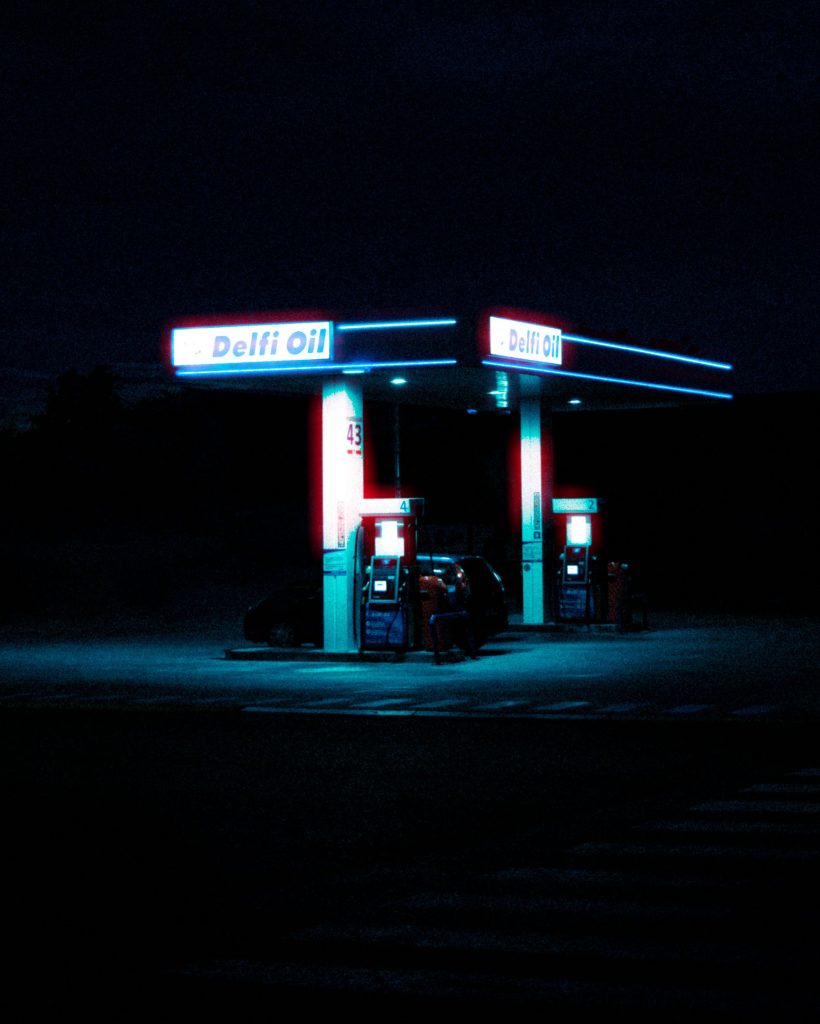Car refueling at gas station