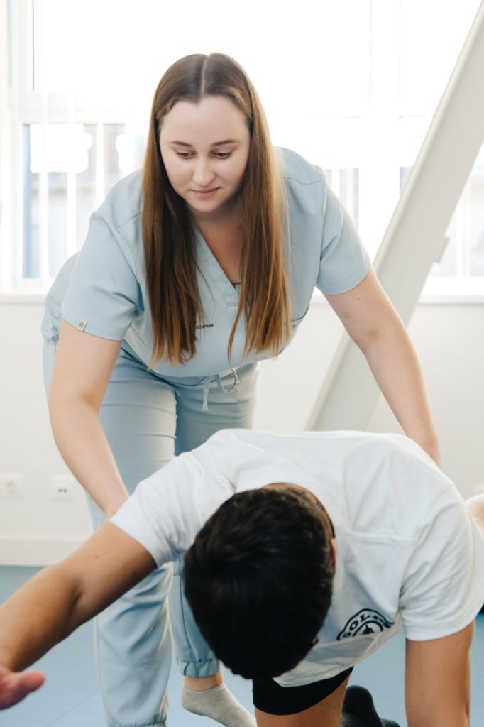 Nexolume Physiotherapy Physiotherapist Helping Exercise