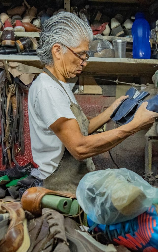 Shoemaker crafting leather footwear