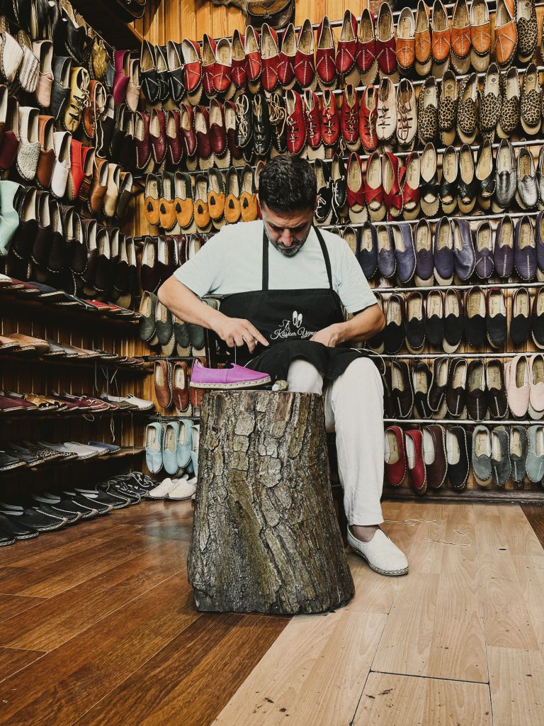 Shoemaker crafting leather products