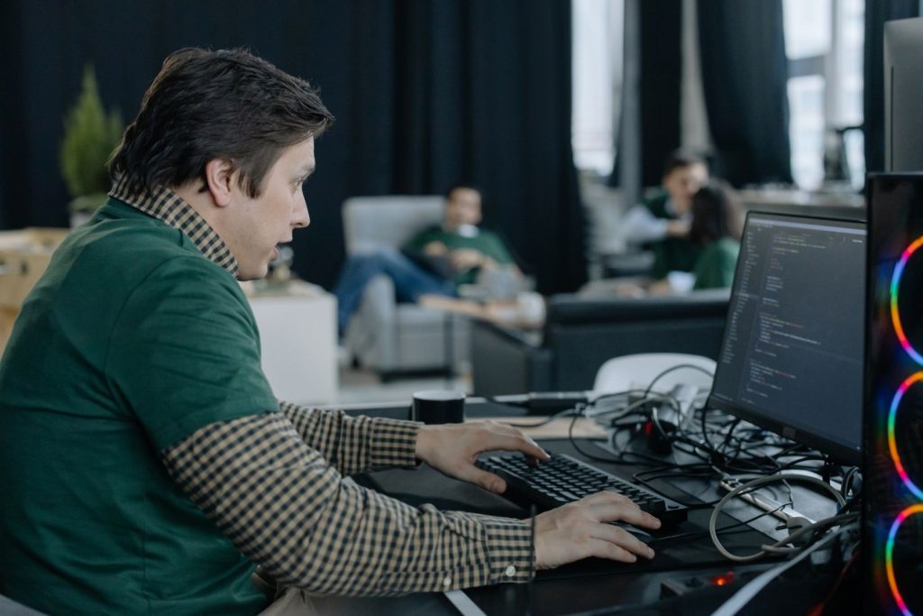 Nexolume Software House & Product Engineering programmer working in modern office