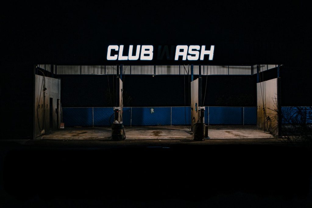 Eerie nighttime view of an empty self-service car wash in Pedro Meoqui, Mexico.