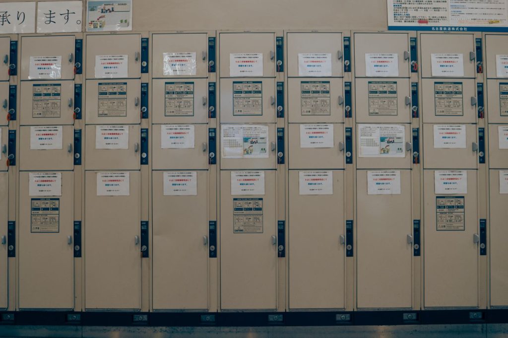 A row of lockers with notices in a Japanese school corridor in Nagoya.