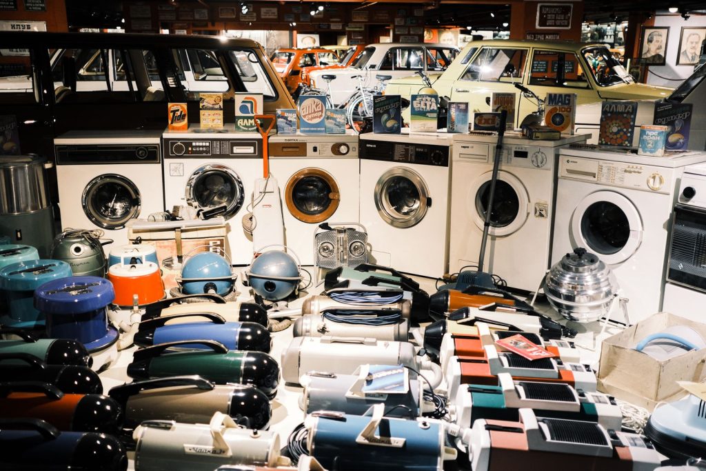 A nostalgic display of vintage washing machines and vacuum cleaners in a Bulgarian museum.