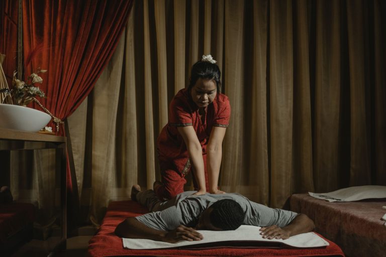 A calming massage therapy session in a spa setting with a focus on relaxation and wellness.