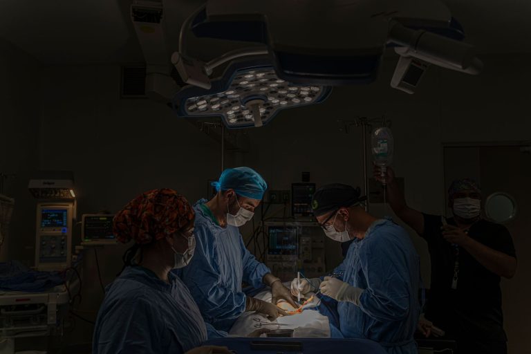 A surgical team conducts an operation in a well-equipped hospital operating room in Mexico.