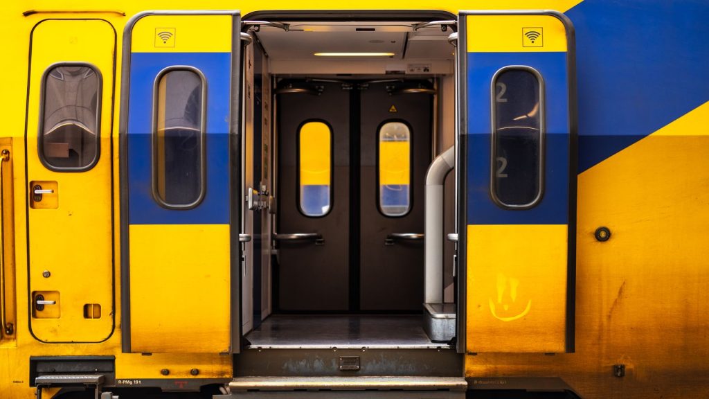 Close-up of open doors on a colorful Dutch train in the Netherlands.