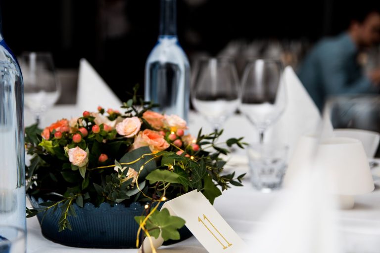 A beautifully arranged floral centerpiece on an elegantly set table, perfect for special occasions.