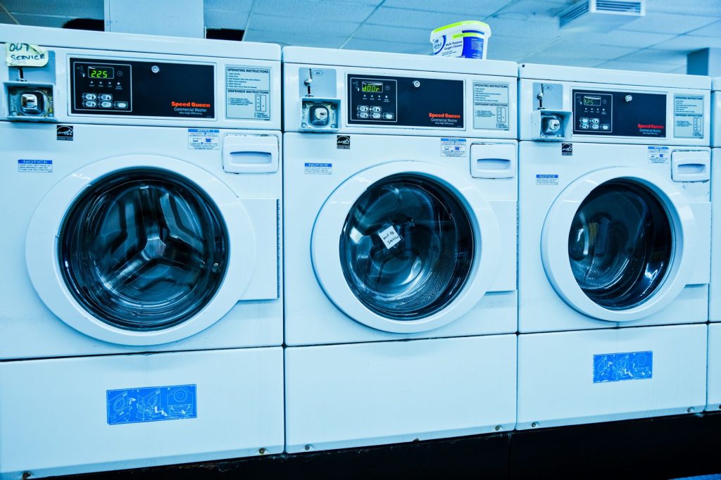 Clean row of front load washing machines