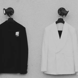 Elegant black and white suit jackets on display