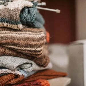 Close up photo of folded knitted sweaters