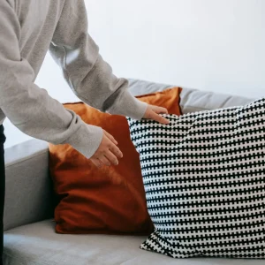Crop photo of woman holding a throw pillow