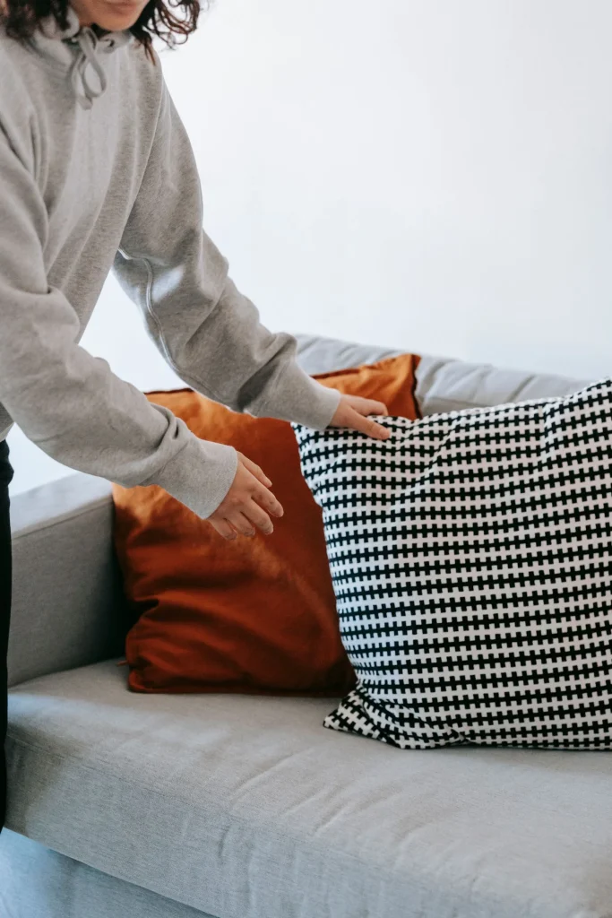 Crop photo of woman holding a throw pillow