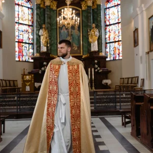 A priest in beige vestment