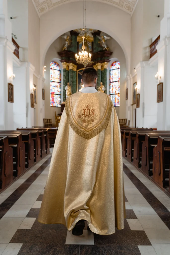 A priest in beige vestment