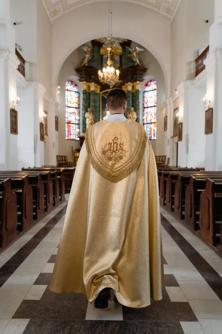 A priest in beige vestment