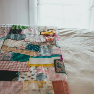 Patchwork quilt on bed