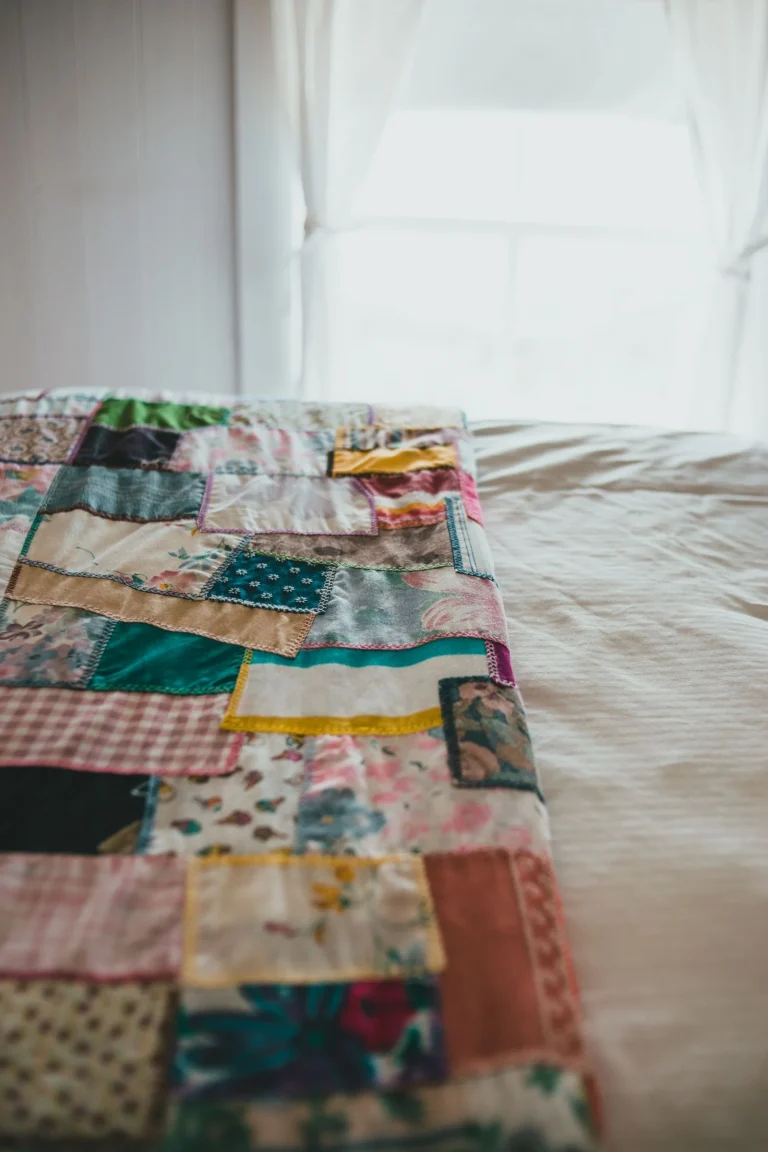 Patchwork quilt on bed