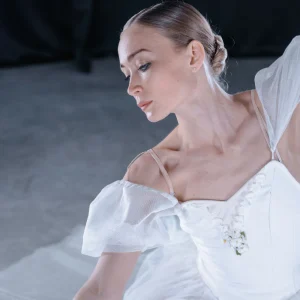 A ballerina in a white dress
