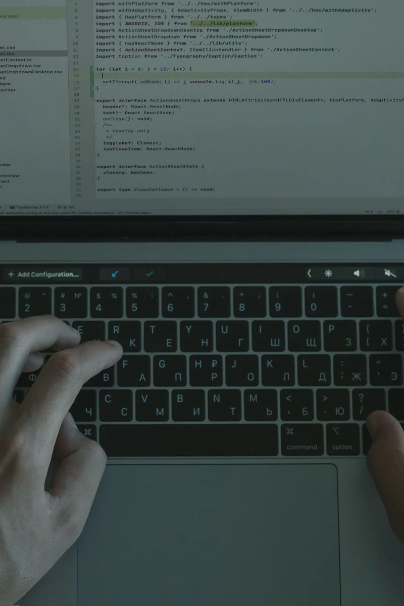 Hands coding a WordPress project on a laptop